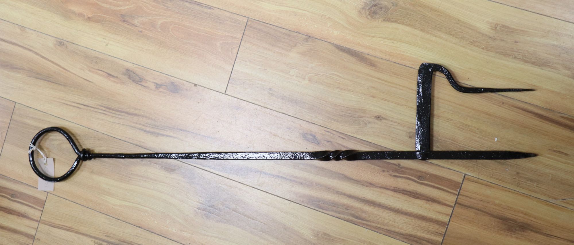 A Victorian wrought boot scraper, with ring handle, length 103cm